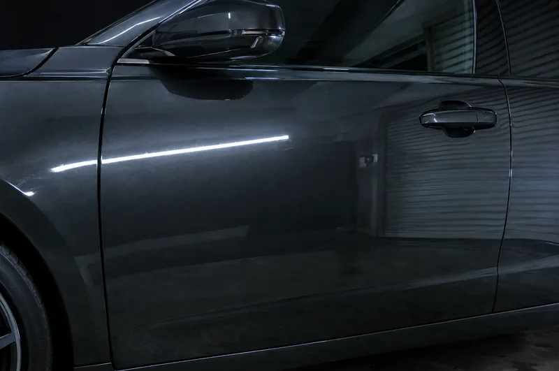 Corrected dark door with a crisp reflection